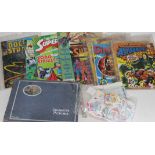 A quantity of vintage comics including superman and doctor strange, stamps and cigarette card album.