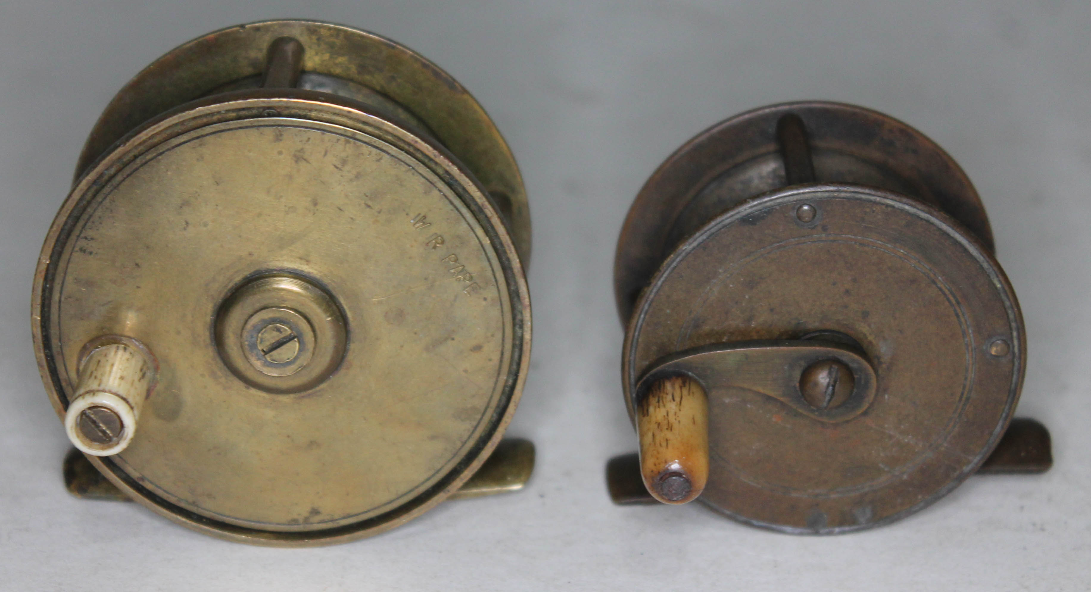 Two Vintage brass fishing reels including W.R.Pape