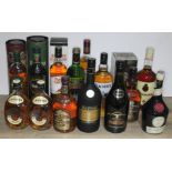 10 bottles of various whisky together with two bottles of brandy and another.
