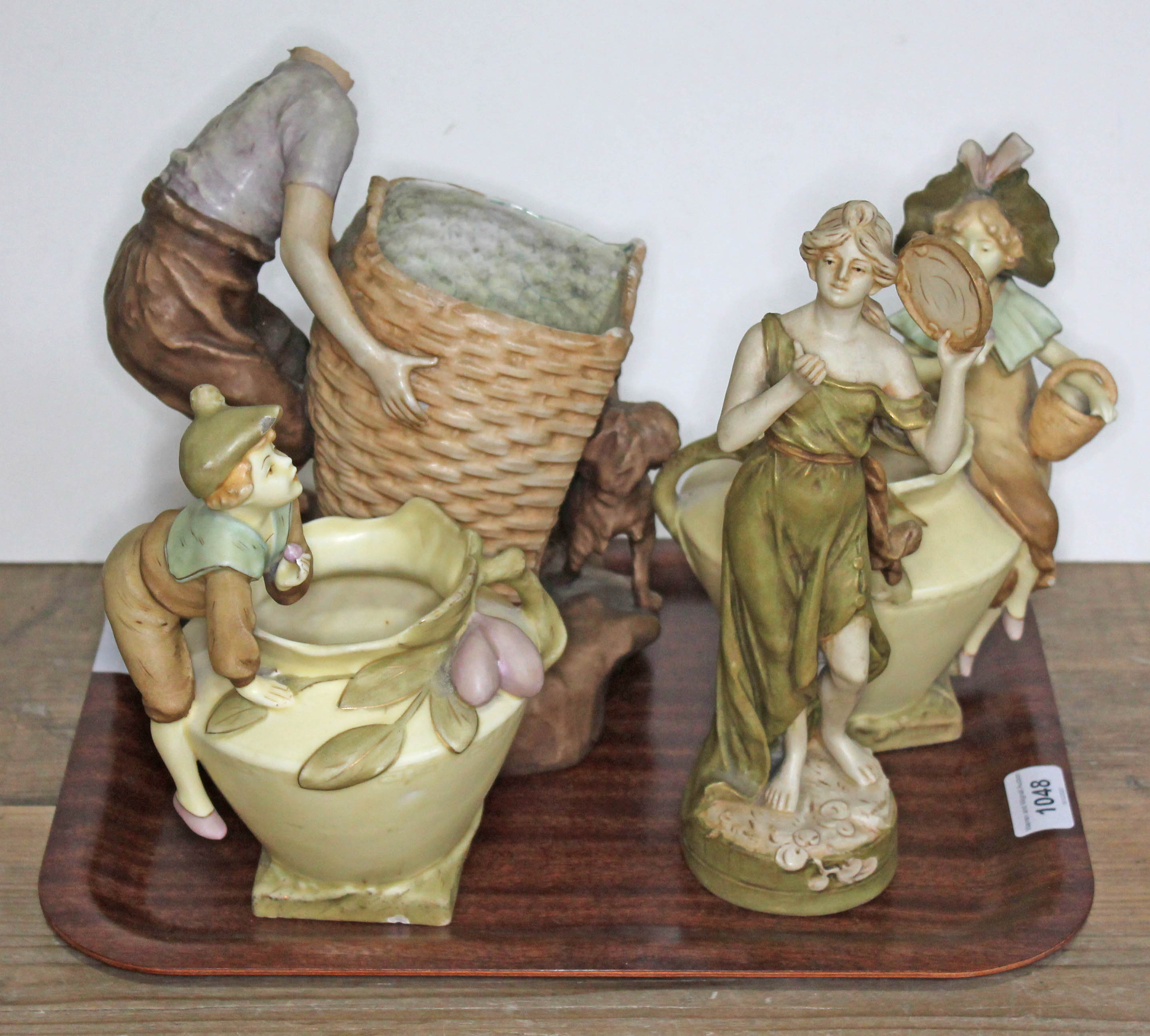 Four Royal Dux figures comprising a pair of vases with boy and girl, boy with large basket and dog