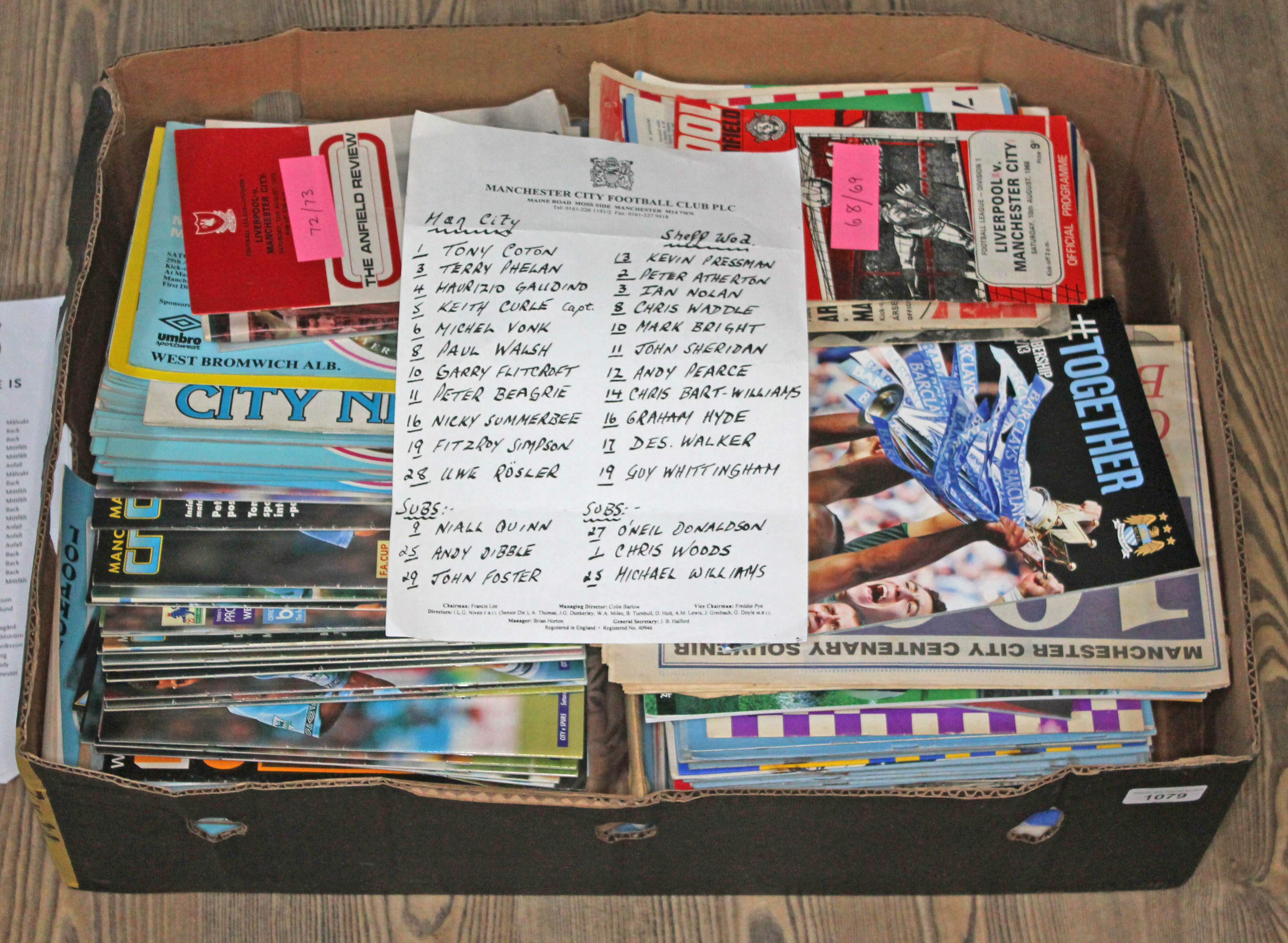 A box of football programmes