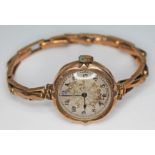 A ladies 9ct gold wristwatch with strap marked '9ct', gross wt. 20.48g.