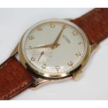 A vintage 1960s gold plated Technos wristwatch with signed champagne dial having Arabic numerals and