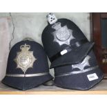 Three policeman's helmets - Hertfordshire, Flintshire and North Wales constabularies.