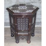 A mother of pearl inlaid and carved moorish table, height 49cm.