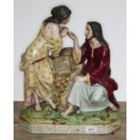 A large 19th century pottery figure group after Carrier Belleuse depicting a courting couple by a