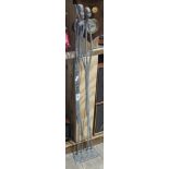 An elongated metal African figure of a man and woman, height 89cm.