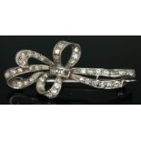 An Edwardian diamond encrusted brooch, length 44mm, gross wt. 5.36g.