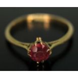 An Edwardian ring set with a round mixed cut pinkish red tourmaline weighing approx. 0.53ct, band