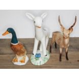 A Beswick stag, a Beswick duck and a Midwinter 'Larry The Lamb', heights 20cm, 18cm, & 21cm.