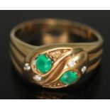 A hallmarked 9ct gold ring formed as entwined snakes and set with green and colourless stones, gross