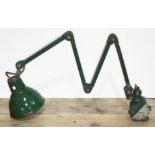 A vintage scissor action adjustable lamp.