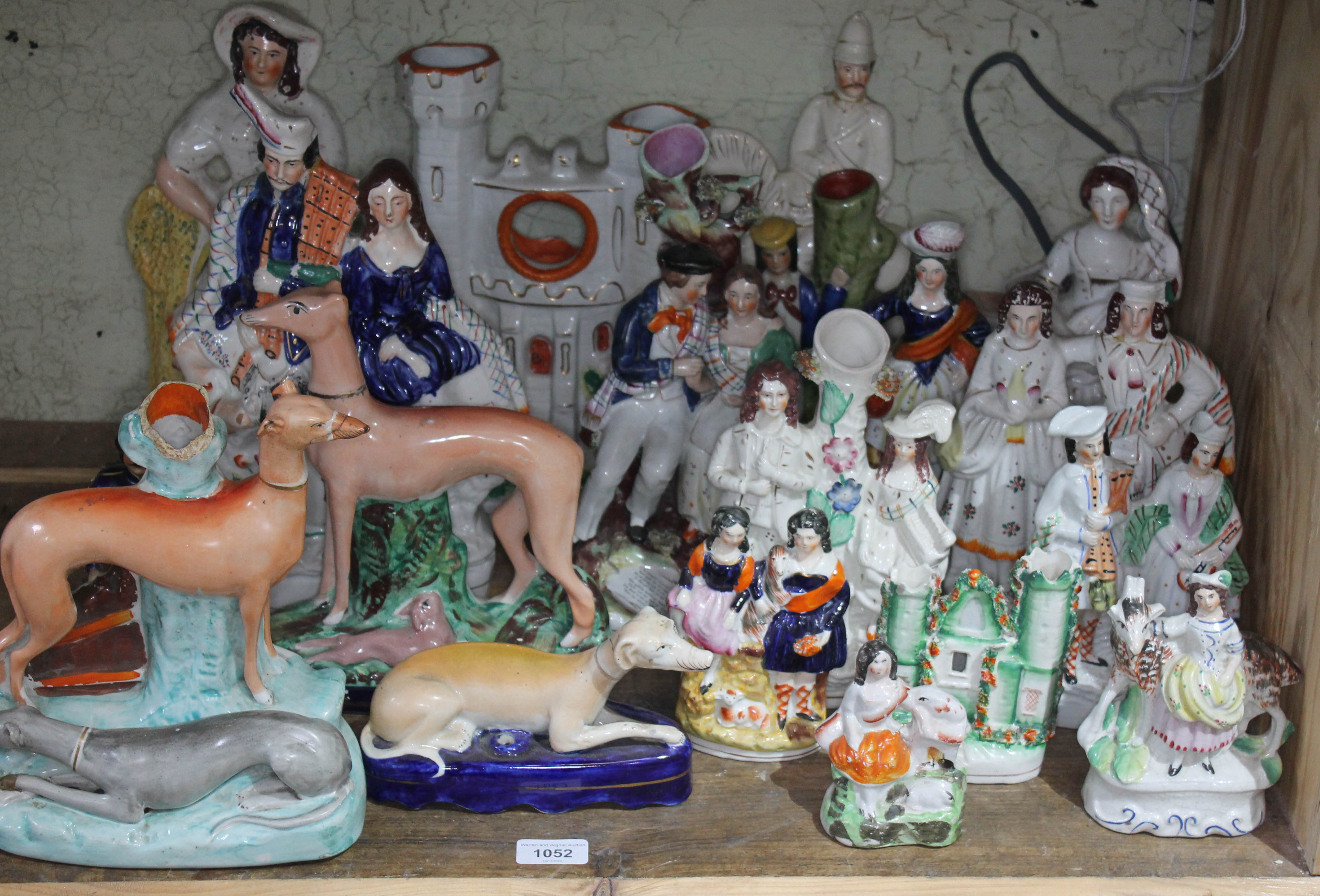 A collection 19 mainly 19th century Staffordshire figures including flat backs, dogs, etc, tallest