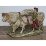 A Royal Dux figure group of a boy and two oxen, model number 837, height 27cm, length 39cm.