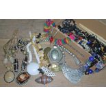 A box of costume jewellery including horn and white metal, beads etc.