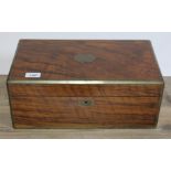 A 19th century walnut writing box with brass inlaid canted corners, tooled black leather writing
