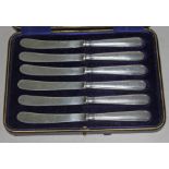 Cased set of hallmarked silver handled knives.