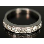An Art Deco seven stone diamond ring, total approx. diamond wt. 0.42ct, white metal band marked '
