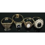 A group of four rings comprising three hallmarked 9ct gold and another marked '9ct', gross wt. 11.