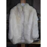 A blonde mink fur coat, length 88cm.