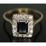 An Art Deco style diamond and sapphire ring, the emerald cut sapphire weighing approx. 1.32ct,