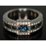 A sapphire and diamond ring, Art Deco style with three rows of stones and central channel set