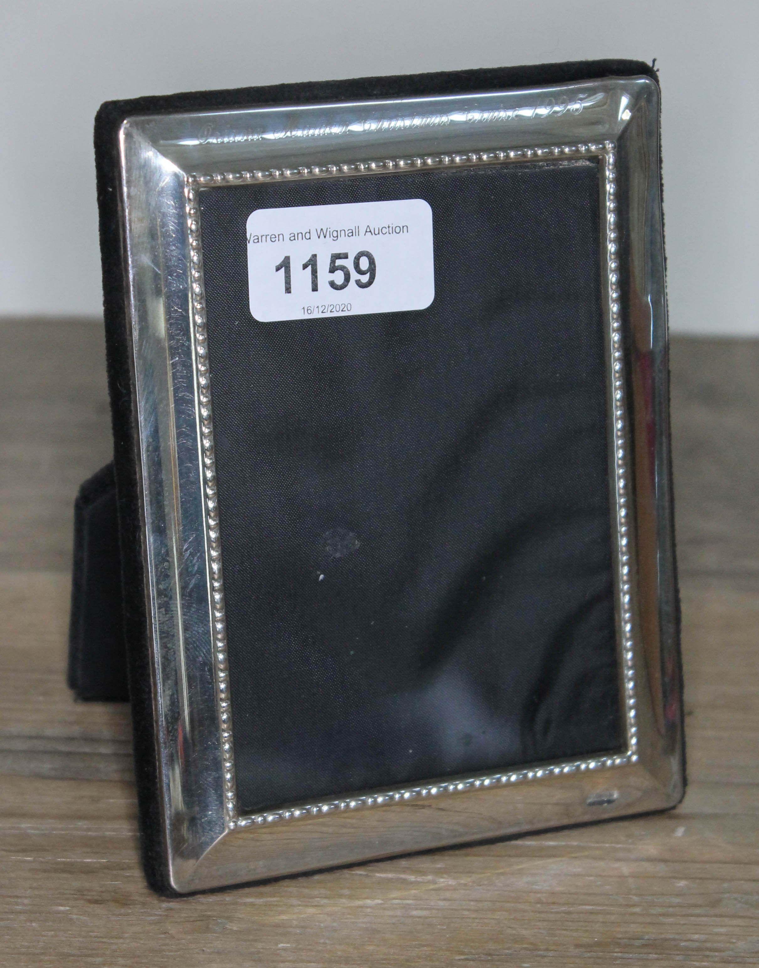 A hallmarked silver photo frame 11.5cm x 15cm.
