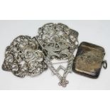 A mixed lot comprising a hallmarked silver belt buckle, a hallmarked silver vesta and a white