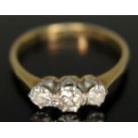 A three stone diamond ring, band marked 'PLAT 18ct', 1.96g, size K.