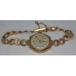 A ladies Ensign 9ct gold wristwatch with 9ct gold strap, gross wt. 14.88g.