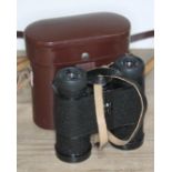 A pair of Carl Zeiss Jena binoculars, serial number 7053130 in leather case Good condition.