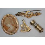 A mixed lot of hallmarked 9ct gold comprising a cameo brooch, two charms and a brooch, gross wt. 9.