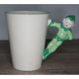 A Clarice Cliff Gnome ware beaker, height 9cm.