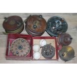 Seven assorted fishing reels and three vintage golf balls.