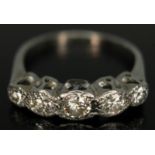 An early 20th century five stone diamond ring, total approx. diamond wt. 0.56ct, band marked 'PLAT',