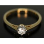 A hallmarked 18ct gold diamond solitaire ring, the modern round brilliant cut stone weighing approx.
