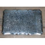 A hallmarked silver bright cut engraved card case, Birmingham 1897, 10cm x 7.2cm. Condition: hinge