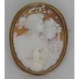 A large Victorian shell cameo brooch, of oval form and finely carved with two ladies in the clouds