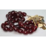 A single strand of cherry amber beads, ranging from 15mm to 20mm each, total length approx. 50cm,