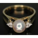 A cultured pearl and diamond ring, marked '14K' and '585', gross wt. 4.15g, size N/O.
