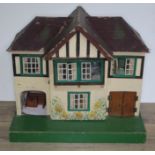 A G & J Lines early 20th century dolls house with furniture and bag of dolls, height 43cm, width