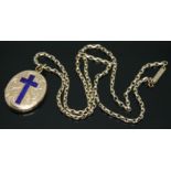 A yellow metal photo locket engraved and inlaid with a lapis lazuli crucifix, 21mm x 25mm, on chain,