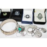 A mixed lot of jewellery comprising four Art Deco style costume rings, a hallmarked silver bangle,