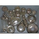 A quantity of mainly hallmarked silver topped bottles, pepper pots etc.