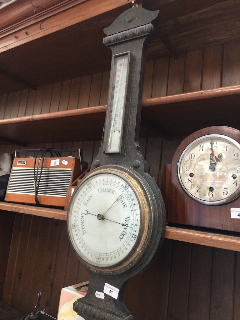 An oak barometer Catalogue only, live bidding available via our webiste. If you require P&P please