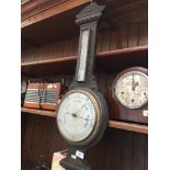 An oak barometer Catalogue only, live bidding available via our webiste. If you require P&P please