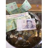 A tin of world coins and bank notes Catalogue only, live bidding available via our webiste. If you