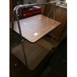 A retro trolley and an oak table Catalogue only, live bidding available via our webiste. If you