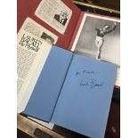 A signed Lauren Bacall autobiography book and a scrapbook containing various signatures and pictures