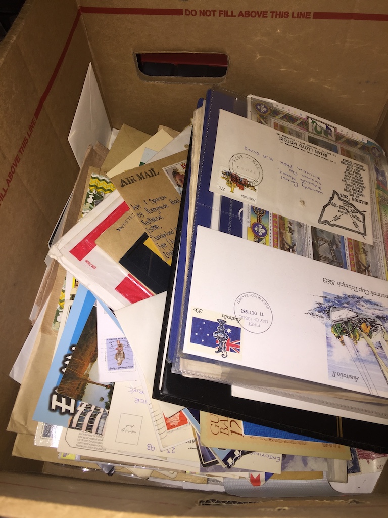 A box of stamp albums and first day covers Catalogue only, live bidding available via our webiste.